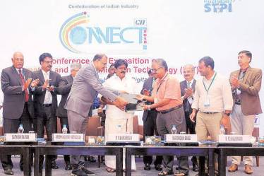Santhosh K Misra, CEO, Tamil Nadu e-Governance Agency, and Ravindra Gettu, Dean (Industrial Consultancy and Sponsored Research), IIT Madras, signed MoU for enhancing data-driven governance, in presence of IT minister M Manikandan