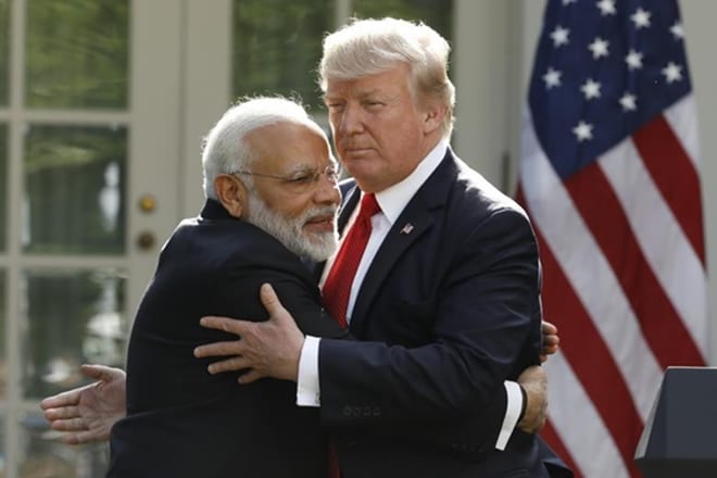 India's Prime Minister Narendra Modi hugs President Donald Trump as they give joint statements in the Rose Garden of the White House in Washington. REUTERS/Kevin Lamarque