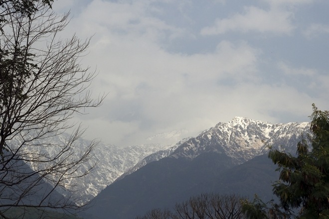 The snow-clad Dhauladhar mountain range after the season's first snowfall in Himachal Pradesh's Palampur on Saturday. (IANS) The snow-clad Dhauladhar mountain range after the season's first snowfall in Himachal Pradesh's Palampur on Saturday. (IANS)