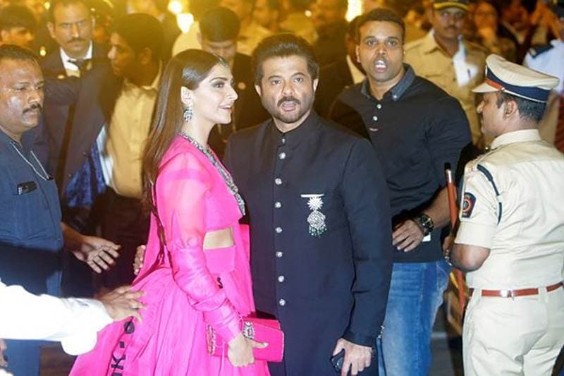 Bollywood actor Anil Kapoor with his daughter actress Sonam Kapoor at the ceremony at Antilia residence in Mumbai. (Image: AP)