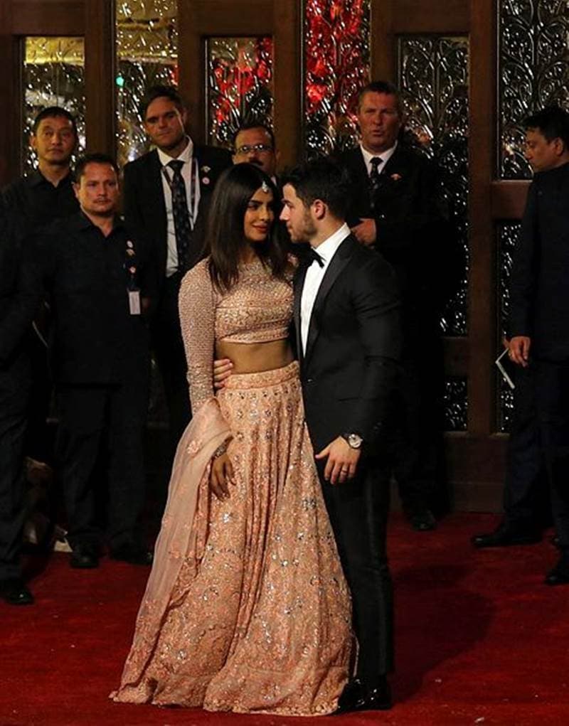 Newlyweds Bollywood actress Priyanka Chopra with her husband Nick Jonas at the wedding of Isha and Anand. (Image: Reuters)