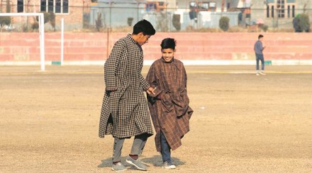 At a stadium in Bandipora, boys are seen wearing pherans. (Express photo by Shuaib Masoodi)
