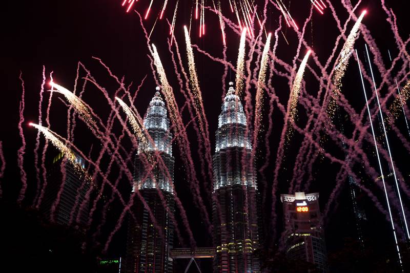 Fireworks in front of the iconic Petronas Twin Towers of Malaysia, during the New Year's celebration in Kuala Lumpur, Malaysia (AP Photo)