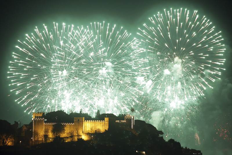 Fireworks light the sky behind Lisbon's Saint George castle. (AP Photo)