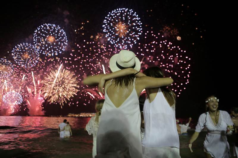 People watching fireworks at Copacabana beach in Rio de Janeiro, Brazil. (Reuters)