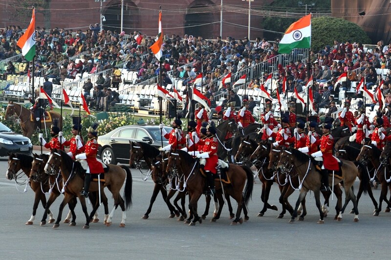 The horse-mounted personnel with the Indian national flag