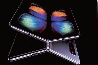 The Galaxy Fold phone is shown on a screen at a Samsung event in San Francisco (REUTERS image)