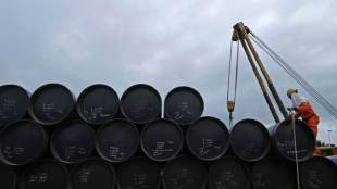 Oil firm on falling US fuel inventories, but record output drags on prices