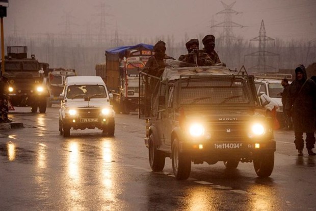 Security personnel move towards the site of the suicide bomb attack (PTI Photo/S Irfan)
