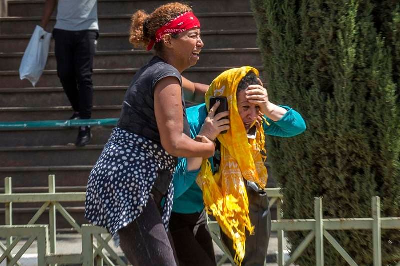 Around the world, families were gripped by grief. (AP Photo)