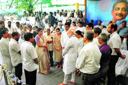 Prime Minister Narendra Modi and Defence Minister Nirmala Sitharaman with the family of Manohar Parrikar in Panaji, Monday. (Image: PTI)