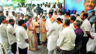Prime Minister Narendra Modi and Defence Minister Nirmala Sitharaman with the family of Manohar Parrikar in Panaji, Monday. (Image: PTI)