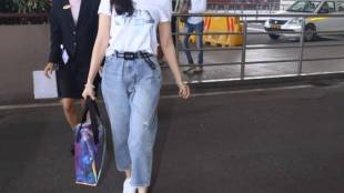 Gold hovers near 2-week lows as dollar gains on upbeat US data