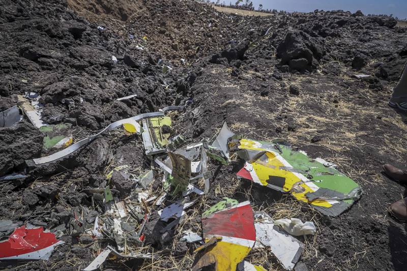 Wreckage lies at the scene of an Ethiopian Airlines flight that crashed shortly after takeoff at Hejere near Bishoftu, or Debre Zeit, some 50 kilometers (31 miles) south of Addis Ababa, in Ethiopia. (AP Photo)