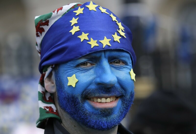 A protester smiles during a Peoples Vote anti-Brexit march in London on Saturday demanding that Britain's Conservative-led government hold a new referendum on whether Britain should leave the European Union. (AP photo)