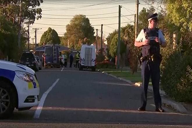 Police officers and vehicles are seen behind police cordon, in Christchurch, New Zealand. (TVNZ via Reuters)