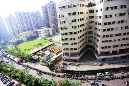 Voters queue up outside a polling centre in Greater Noida during the first phase of elections on Thursday.(Express Photo by Gajendra Yadav)