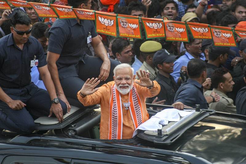 Prime Minister Narendra Modi on Thursday undertook a mega roadshow at his parliamentary constituency in Varanasi, Uttar Pradesh. The road show was held a day before PM Modi is slated to file his nomination papers. Wearing a saffron kurta and scarf, PM Modi's road show was cheered by a huge crowd as he passed through the Lanka and Assi areas of the temple town. (PTI Photo)
