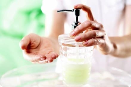 Woman dispenses soap for hands