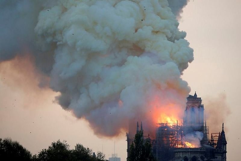 Smoke billows from Notre Dame Cathedral after a fire broke out, in Paris, France April 15, 2019. REUTERS/Charles Platiau