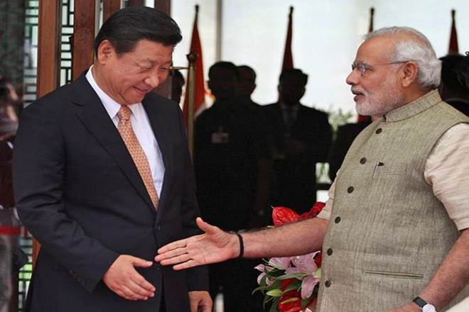 Prime Minister Narendra Modi welcomes Chinese President Xi Jinping, upon his arrival at a hotel in Ahmedabad. (AP Photo/File)