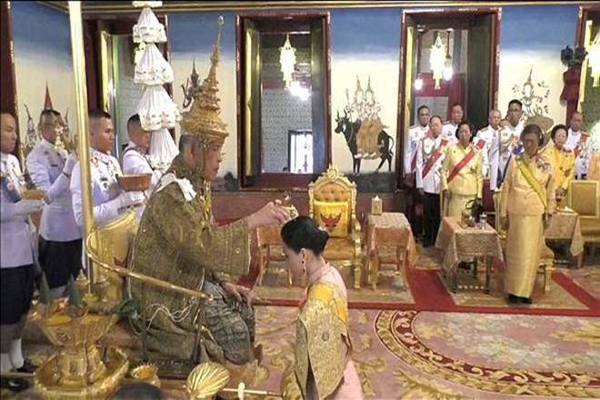 Thailand's King Maha Vajiralongkorn and Queen Suthida attend his coronation in Bangkok. (Reuters)