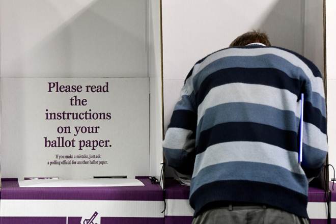 A voter participates in early voting at a pre-polling booth at Central Station, Sydney, Australia, April 29, 2019. REUTERS