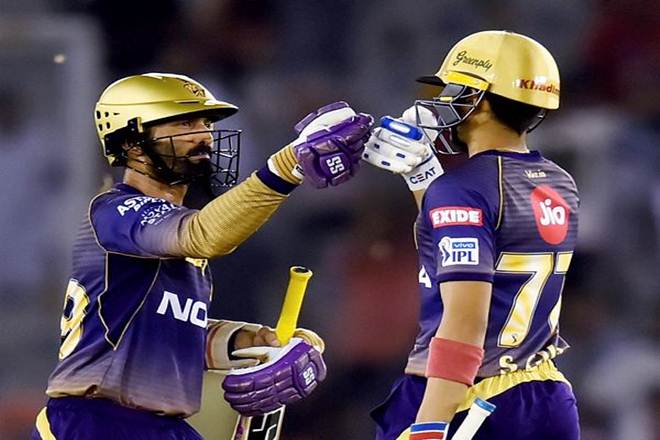 Kolkata Knight Riders (KKR) players Dinesh Karthik and Shubman Gill celebrate their victory against Kings XI Punjab( KXIP) during the Indian Premier League (IPL T20 2019) cricket match at The Punjab Cricket Association Stadium in Mohali