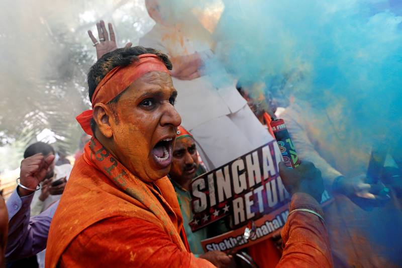 There were some rejoicing crowd who wore Modi masks while others held cut-outs of the prime minister with a message -- 'Singham Returns' (photo: Reuters)