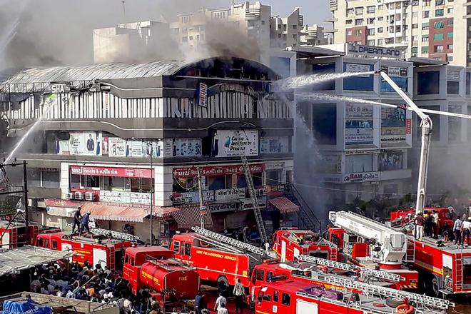 The inquiry revealed that fire on the fourth floor of Takshashila Arcade in Sarthana area of Surat was triggered by a spark in an outer unit of an air conditioner. The inquiry revealed that fire on the fourth floor of Takshashila Arcade in Sarthana area of Surat was triggered by a spark in an outer unit of an air conditioner.