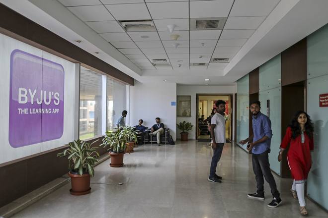 People stand near elevators in the Think and Learn Pvt. office in Bengaluru, India, on Wednesday, April 5, 2017. Online learning is exploding in India, and no company is poised to benefit more than BYJU'S. Its app developed by Think and Learn has been downloaded 8 million times, and more than 400,000 students are paying an annual fee of 10,000 rupees (just over $150) in a country not known to pay for subscriptions of any kind. Photographer: Dhiraj Singh/Bloomberg