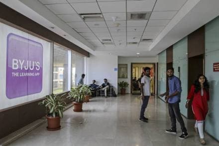 People stand near elevators in the Think and Learn Pvt. office in Bengaluru, India, on Wednesday, April 5, 2017. Online learning is exploding in India, and no company is poised to benefit more than BYJU'S. Its app developed by Think and Learn has been downloaded 8 million times, and more than 400,000 students are paying an annual fee of 10,000 rupees (just over $150) in a country not known to pay for subscriptions of any kind. Photographer: Dhiraj Singh/Bloomberg
