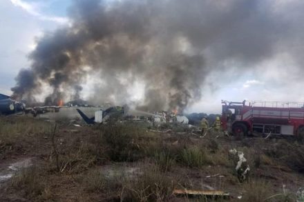 Note: This image is from Mexico's northern state of Durango, July 31, 2018, in which firefighters douse a fire as smoke billows above the site where an Aeromexico-operated Embraer passenger jet which crashed Proteccion Civil Durango/via REUTERS