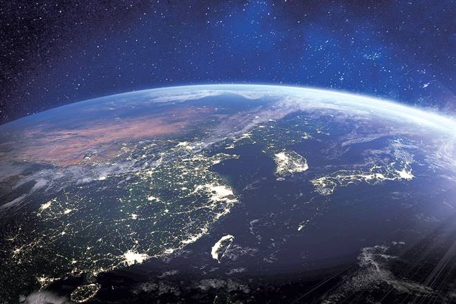 Asia at night from space with city lights showing human activity in China, Japan, South Korea, Taiwan and other countries