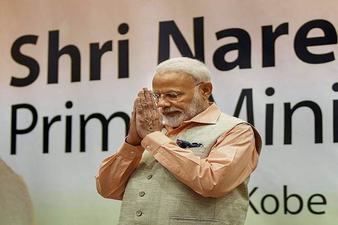 Prime Minister Narendra Modi greets the Indian community during a programme in Kobe (PTI Photo)