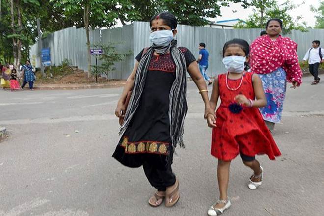 People wear masks as a protective measure after reports of outbreak of Nipah virus (PTI Photo)
