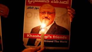 A demonstrator holds a poster with a picture of Saudi journalist Jamal Khashoggi (Reuters photo)