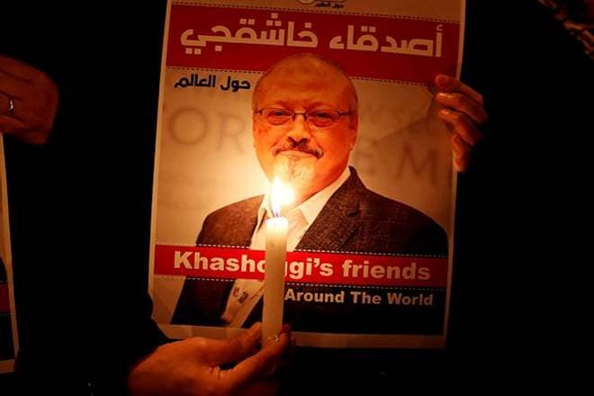 A demonstrator holds a poster with a picture of Saudi journalist Jamal Khashoggi (Reuters photo)