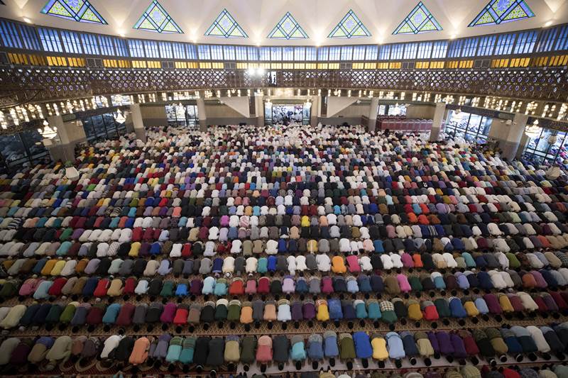 This grand festival symbolises peace and brotherhood. The people offer prayers at mosques and idgahs to seek blessings of the divine. Special dishes are being made to mark the festival. (AP Photo)