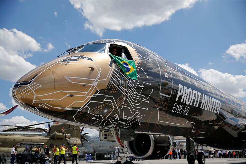 An Embraer E195-2 is seen on display, sporting a livery combining a lion's head with an integrated circuit design, during the 53rd International Paris Air Show at Le Bourget Airport near Paris (Reuters Photo)