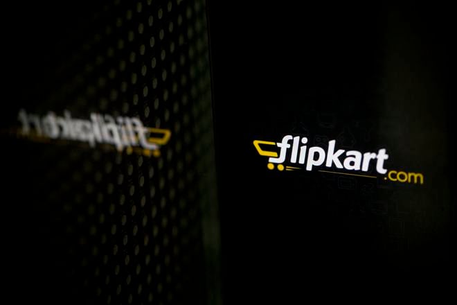 Flipkart's application loading page, displayed on an Apple Inc. iPhone 5c, is reflected on a window in an arranged photograph in Hong Kong, China, on Wednesday, May 21, 2014. Flipkart, India's largest online retailer, will buy competitor Myntra.com, according to people with knowledge of the talks, to gain a business with higher margins and strengthen its position in the local market against Amazon.com Inc. Photographer: Brent Lewin/Bloomberg