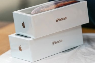 Boxes of the Apple Inc. iPhone XS sit at an Apple store during its launch in Hong Kong, China, on Friday, Sept. 21, 2018. The iPhone XS is up to 0 more expensive than last year's already pricey iPhone X and represents one of the smallest advances in the product line's history. But that means little to the Apple faithful or those seeking to upgrade their older iPhone. Photographer: Anthony Kwan/Bloomberg