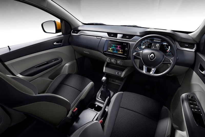 The Renault Triber comes with a dual-tone colour scheme inside the cabin along with silver accents on the dashboard and the door trims. The seats get a fabric upholstery with contrast stitching. This compact 7-seater comes with an 8-inch touchscreen infotainment system. It offers Android Auto and Apple Car Play support.