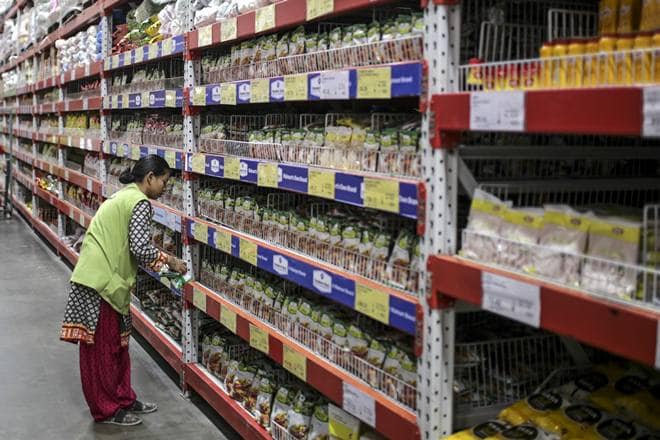 An employees arranges products at a Walmart Inc. Best Price Modern Wholesale store in Hyderabad, India, on Saturday, March 16, 2019. Walmart is making friends in India with the kind of competitors that it spent decades putting out of business in the U.S. -- mom and pop stores. These unlikely allies are part of the retailer's latest attempt to crack the countrys giant consumer market, taking on e-commerce arch-rival Amazon.com Inc. and Asia's richest man, Mukesh Ambani. Photographer: Dhiraj Singh/Bloomberg