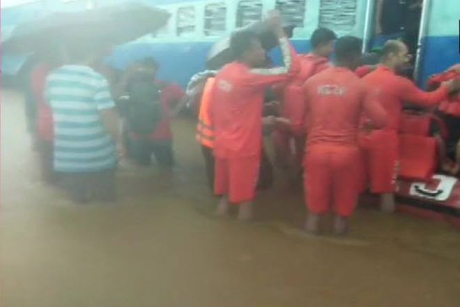 NDRF personnel are rescuing the passengers (ANI Image)