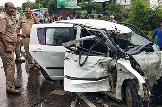 Police stand near the wreckage of the car in which the Unnao rape survivor was travelling during its collision with a truck near Raebareli (PTI Photo)