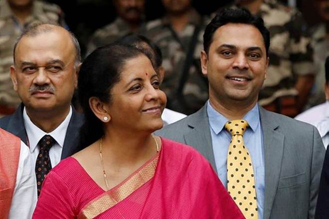 Finance Minister Nirmala Sitharaman (C) and Krishnamurthy Subramanian (R), chief economic adviser pose during a photo opportunity outside their office before the presentation of the federal budget in the parliament in New Delhi