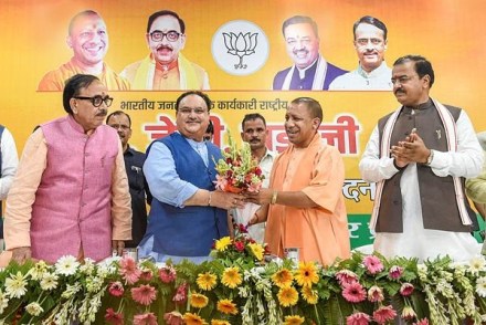 BJP National Working President JP Nadda receives a bouquet from Uttar Pradesh Chief Minister Yogi Adityanath (PTI Photo)