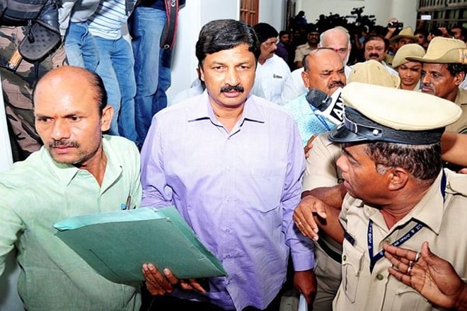 Dissident Congress MLA Ramesh Jarkioholi leaves from speaker's office after submitting his resignation in Bengaluru on Saturday (PTI Photo)