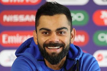 captain Virat Kohli smiles as he responds to a question during a press conference ahead of their Cricket World Cup semifinal match against New Zealand at Old Trafford in Manchester (AP Photo)